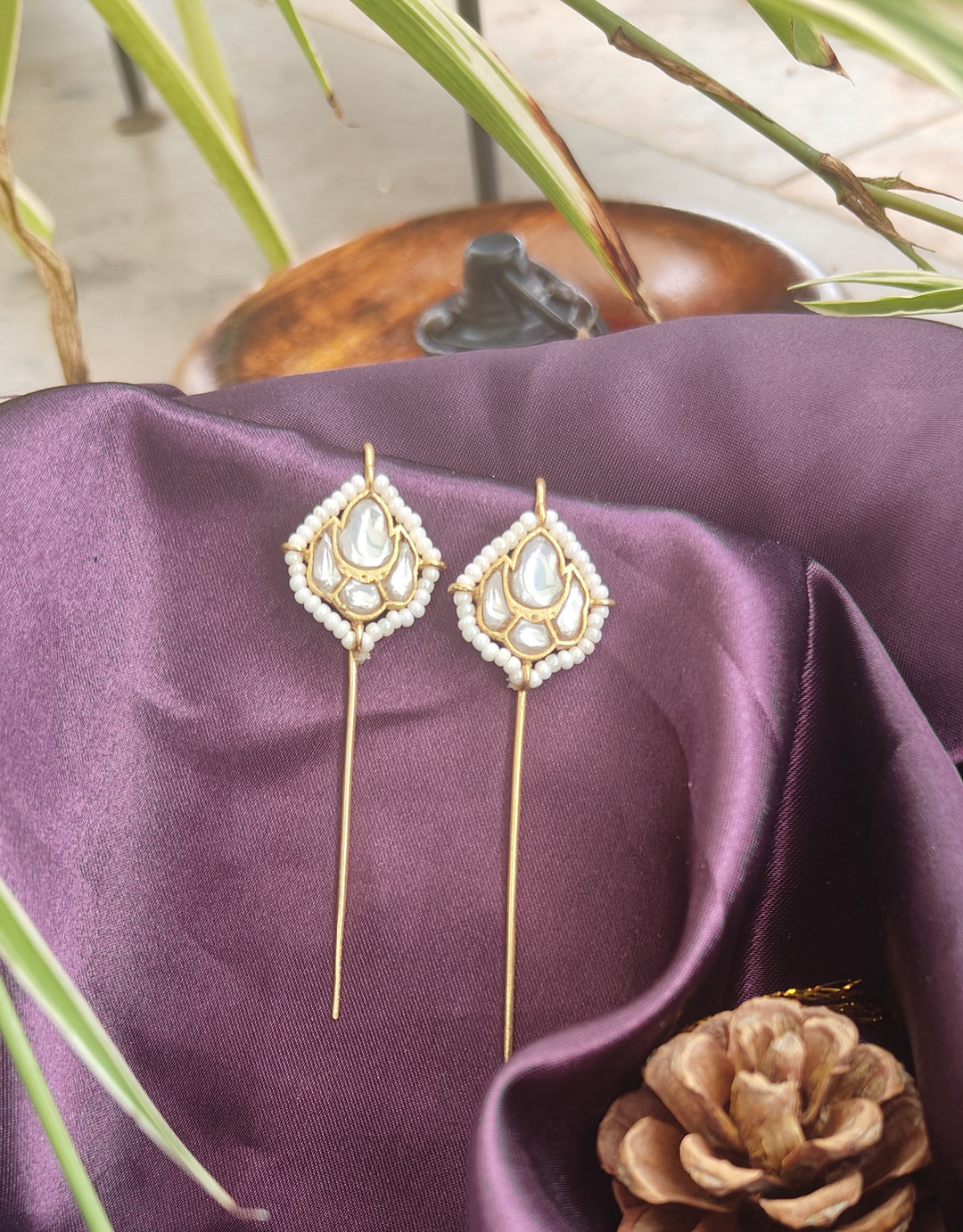 Elegant Brass Earcuffs featuring luminous Kundan stones, delicate pearl accents, and a graceful elongated silhouette