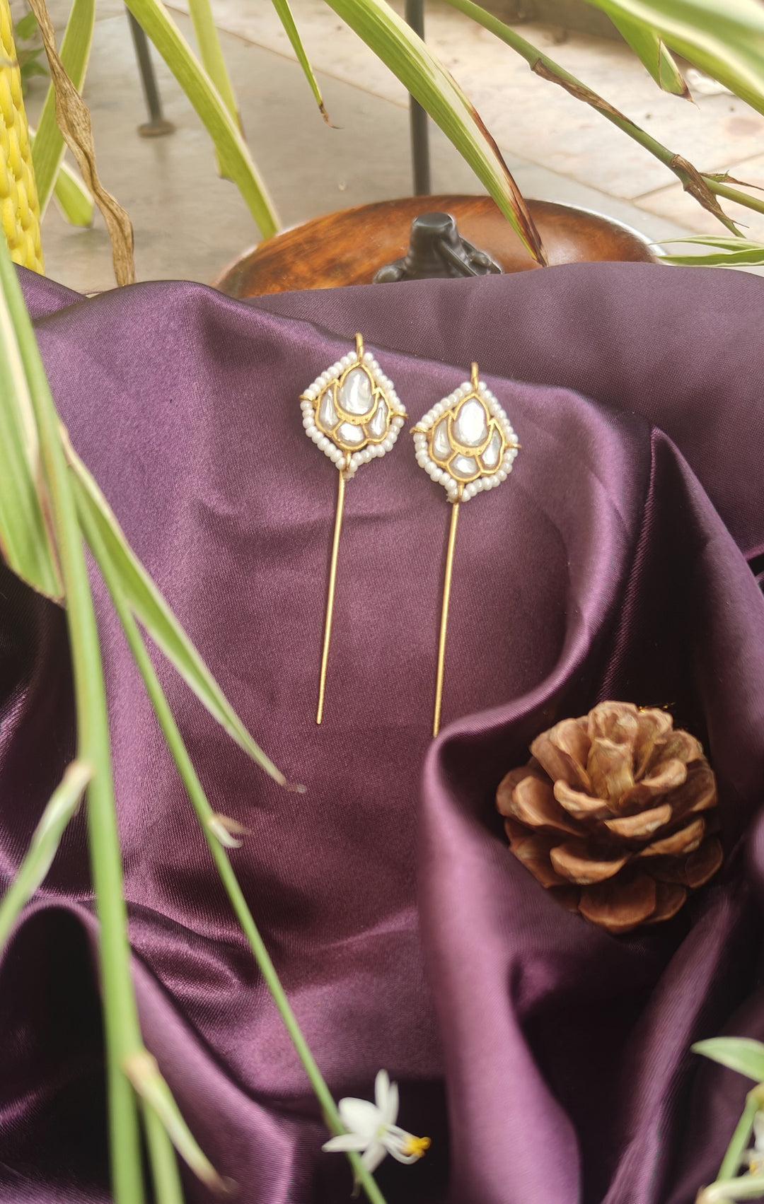 Elegant Brass Earcuffs featuring luminous Kundan stones, delicate pearl accents, and a graceful elongated silhouette