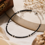 Load image into Gallery viewer, Handcrafted black crystal and oxidized silver star beaded anklet with polished silver spacer beads, adjustable extension chain, and lobster clasp, minimalist boho anklet for women.
